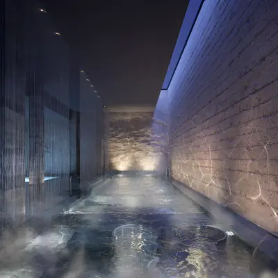 Nighttime wellness spa pool with calming blue ambient lighting