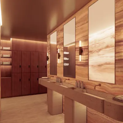 Luxury spa locker room with marble vanities and warm lighting