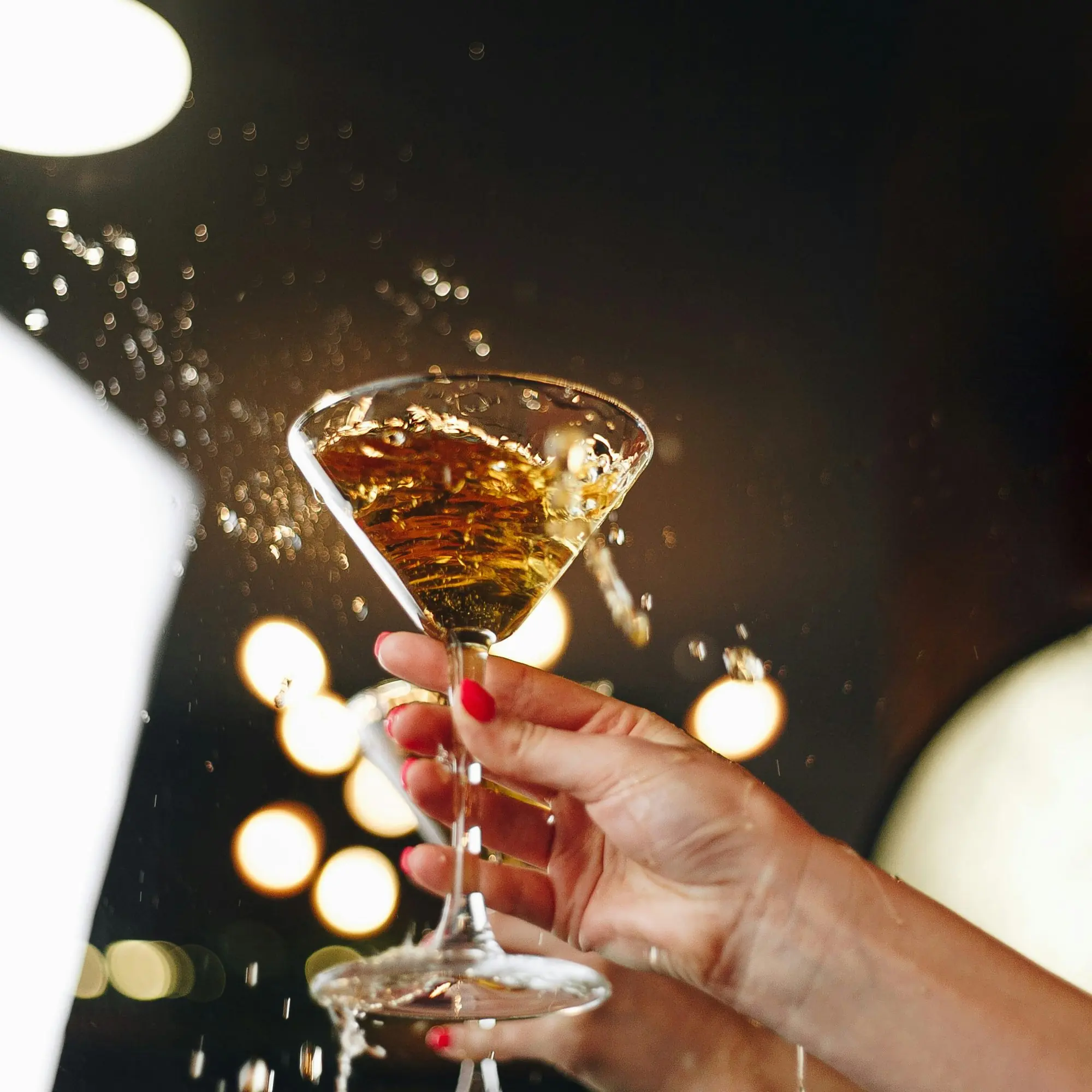 Cocktail being served at luxury rooftop lounge