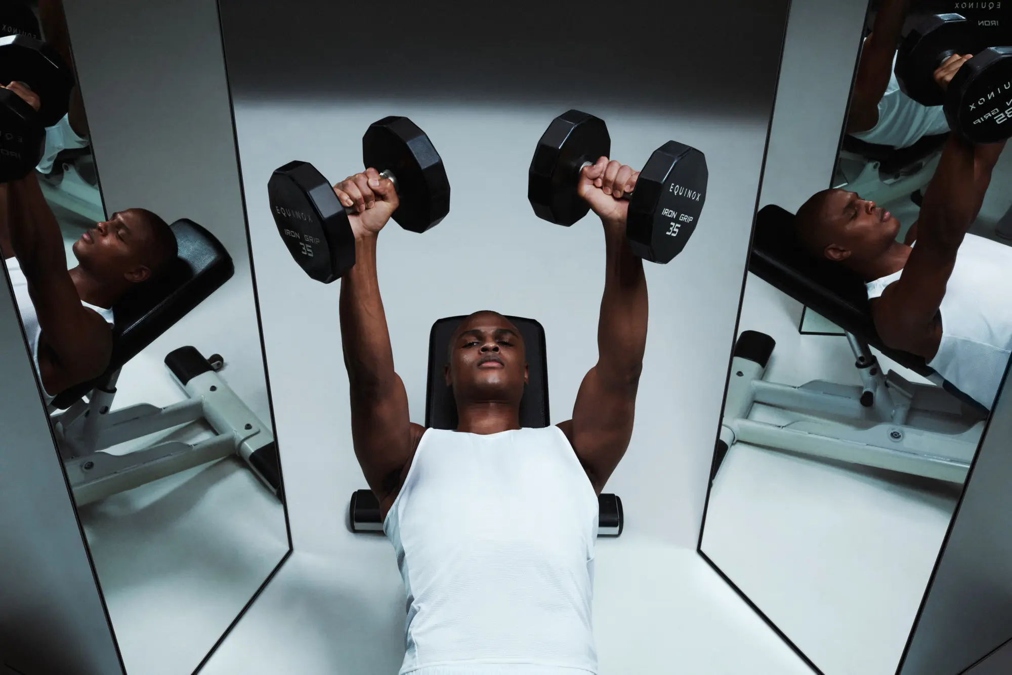Strength training workout with dumbbells at Equinox