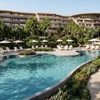 Luxury resort swimming pool with tropical landscaping