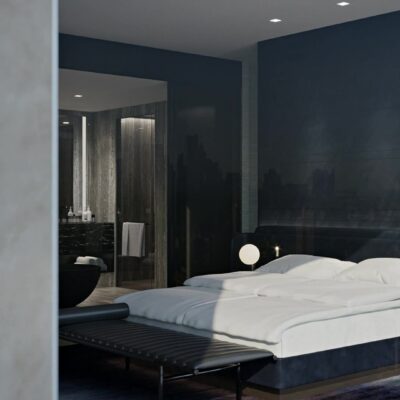 Modern bedroom with white bedding, cityscape mural, and freestanding tub visible through open doorway.
