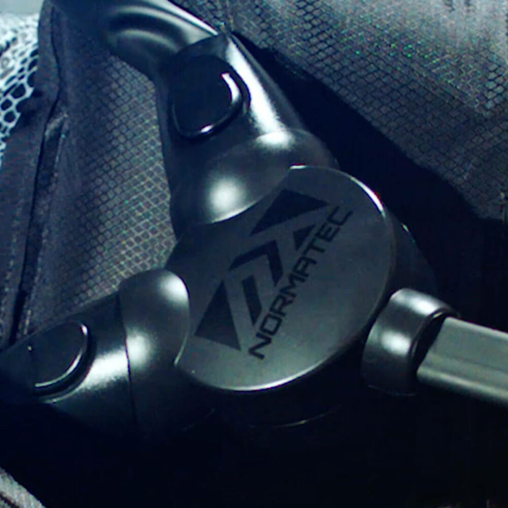 Close-up of Normatec device with tubing, used for compression therapy and athletic recovery.