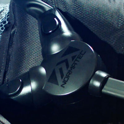 Close-up of Normatec device with tubing, used for compression therapy and athletic recovery.