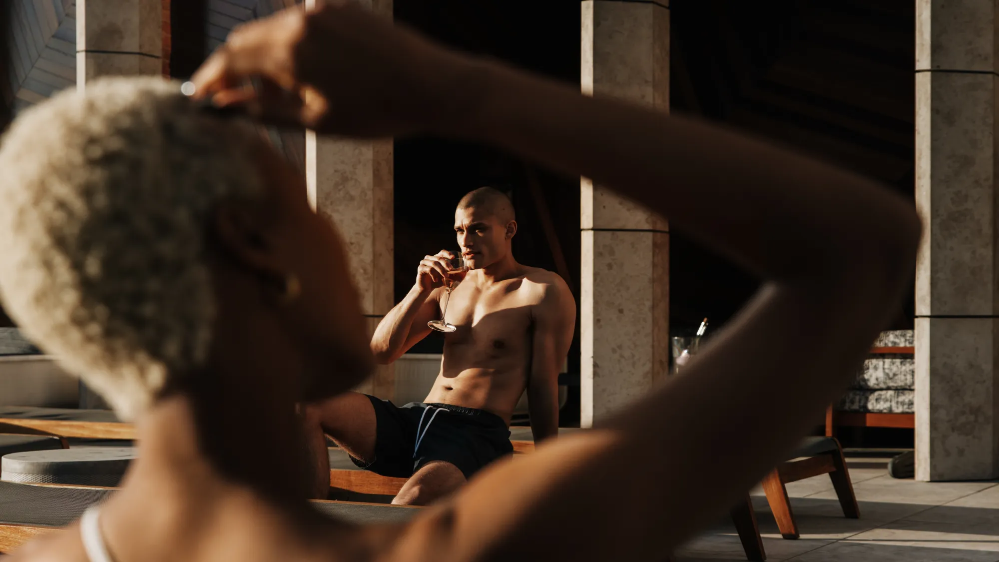 Guests relaxing by the pool at Equinox Hotel New York, enjoying luxury wellness amenities and stylish outdoor spaces.