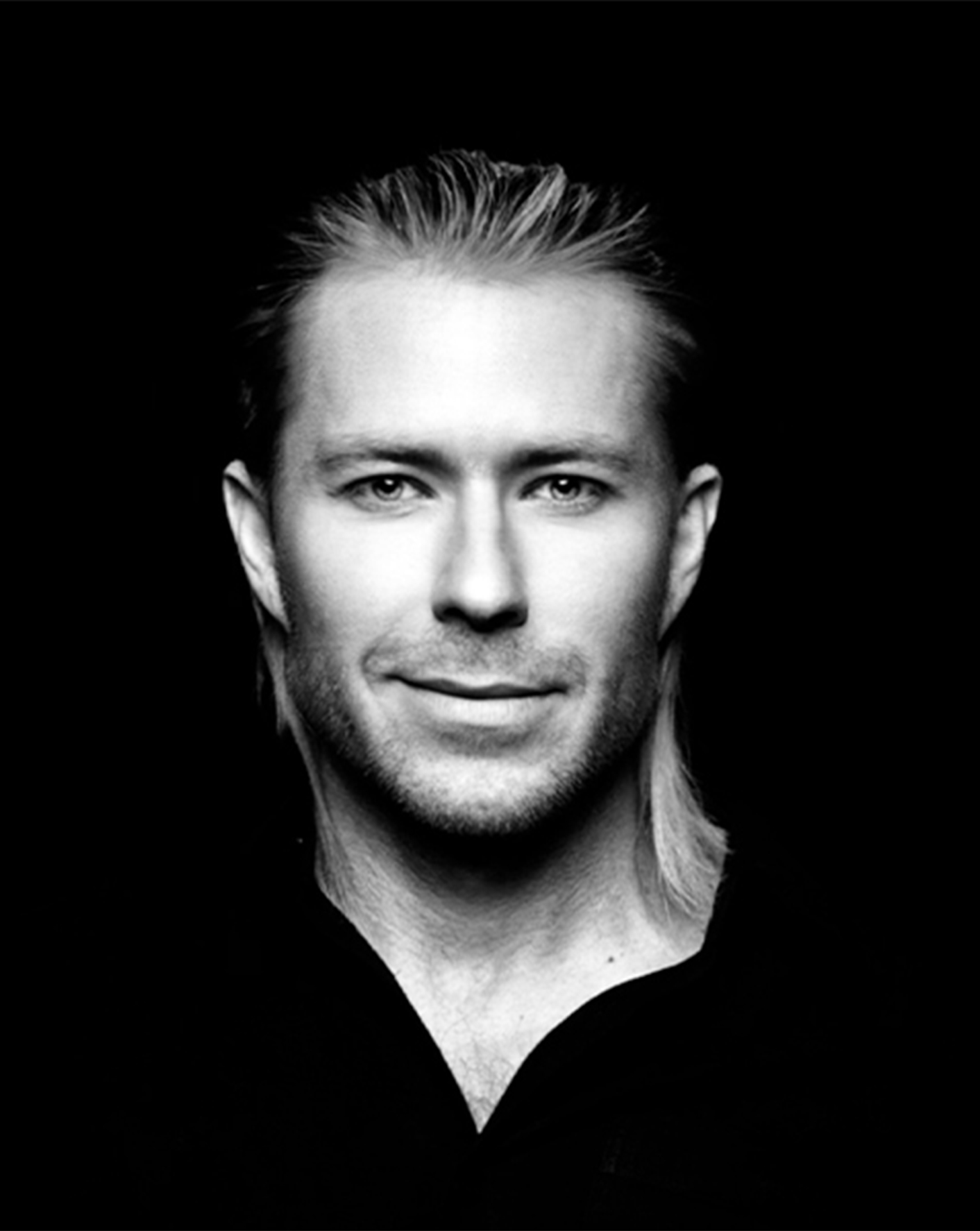 Black and white portrait of Dr. Matthew Walker at Equinox Hotel, facing camera with neutral expression.