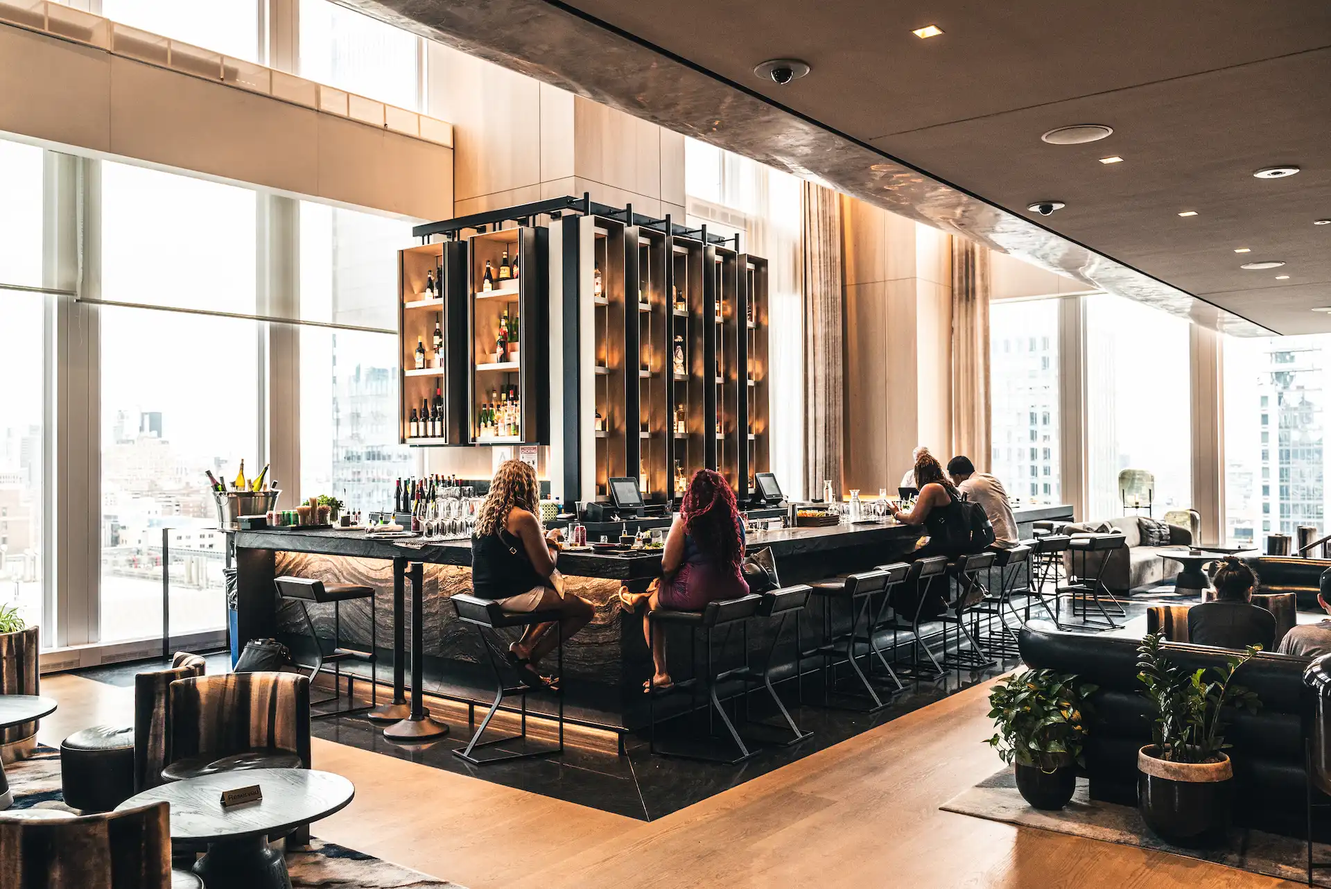 Electric Lemon rooftop bar in New York City featuring sweeping skyline views, warm ambient lighting, and sleek modern design, evoking vibrant elegance and metropolitan allure for an unforgettable dining experience.