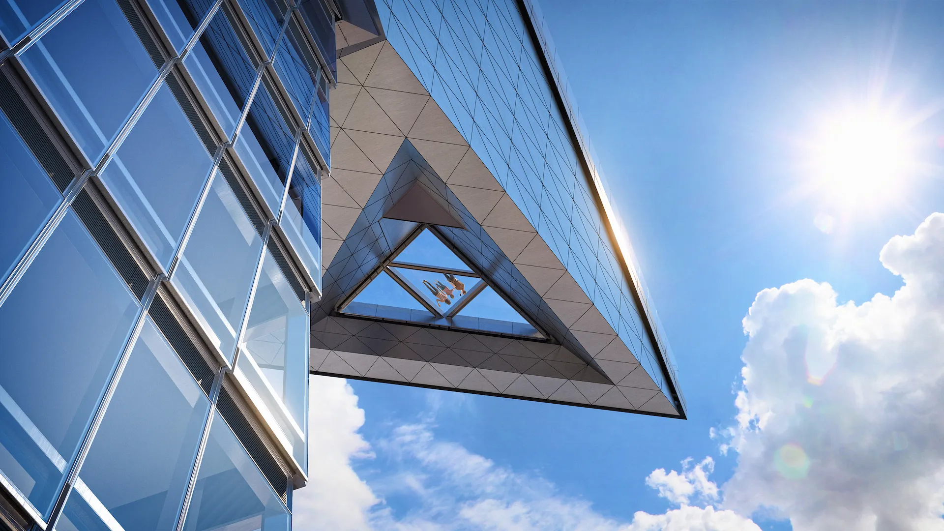 Modern skyscraper with triangular glass overhang and reflective panels, viewed from below against clear sky and sunlit flares