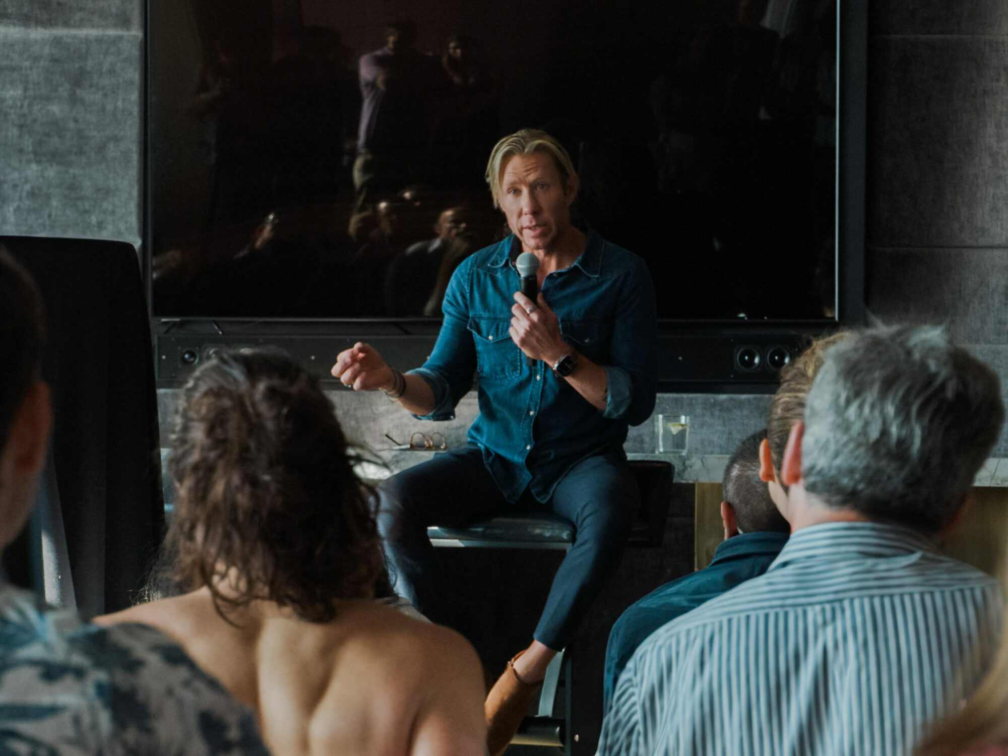 Dr. Matthew Walker leading a chronotype session, speaking to an engaged audience about sleep science.