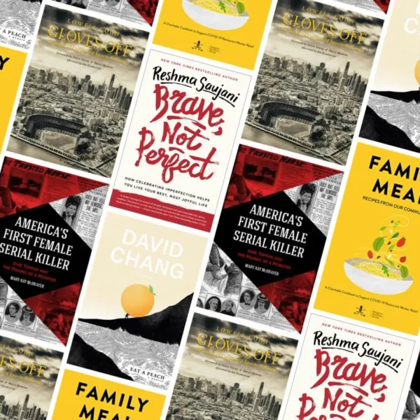 Diagonal collage of book covers featuring memoirs, self-help, culinary, and historical titles on wood surface