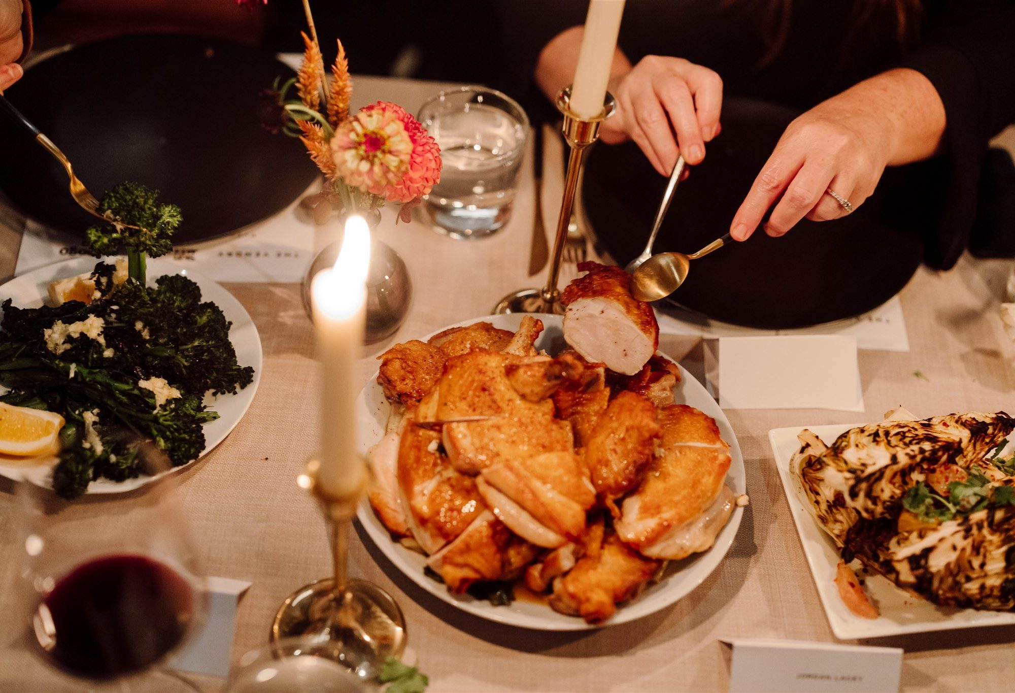 Roast chicken served at a candlelit dinner table