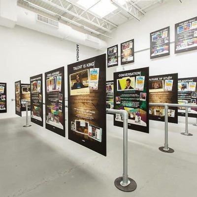 The Petzel Gallery exhibition with black panels on metal stands showcasing design and innovation themes