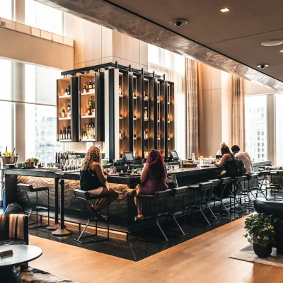 Electric Lemon rooftop bar in New York City featuring sweeping skyline views, warm ambient lighting, and sleek modern design, evoking vibrant elegance and metropolitan allure for an unforgettable dining experience.