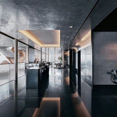 Modern reception area with glossy surfaces, ambient lighting, and minimalist design for a luxury experience.