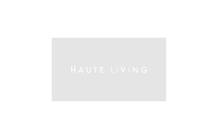 Gray rectangle showing Haute Living logo on white background with no shapes or elements.