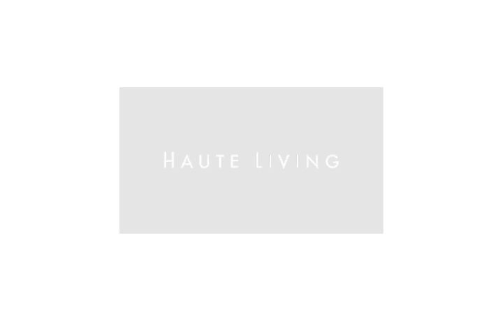 Gray rectangle showing haute living logo on white background with no shapes or elements.