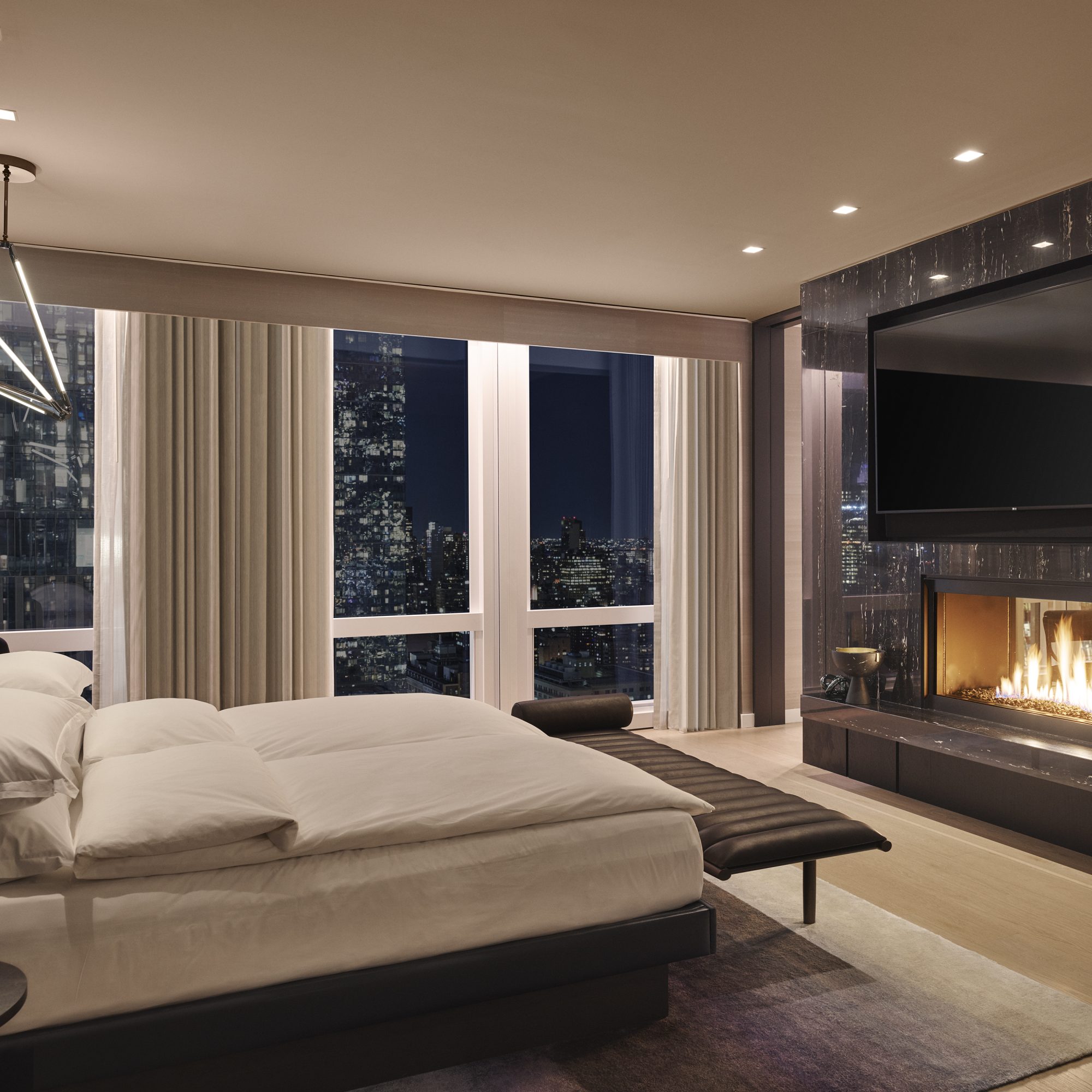 Equinox suite bedroom fireplace