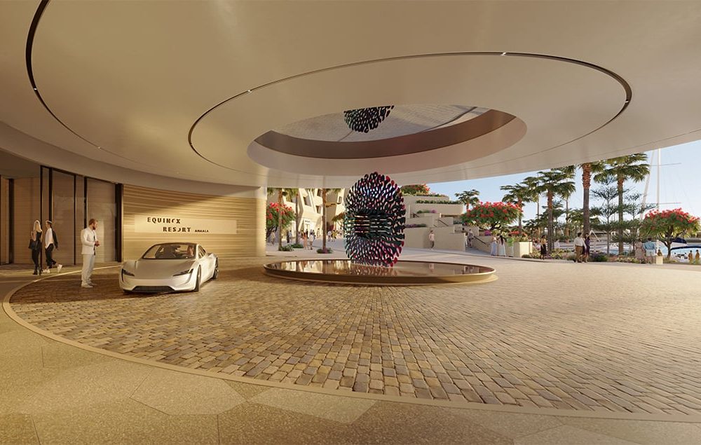 Entrance of Equinox Resort Amaala with abstract sculpture over water feature, white car, and waterfront view