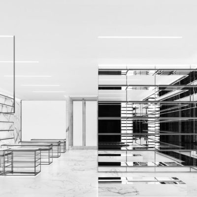Minimalist retail interior with marble walls, glass display tables, and mirrored panel installation